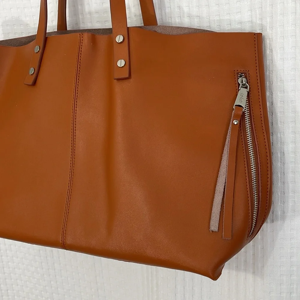 Co-Lab large tan leather‎ tote with attached wristlet. Excellent condition